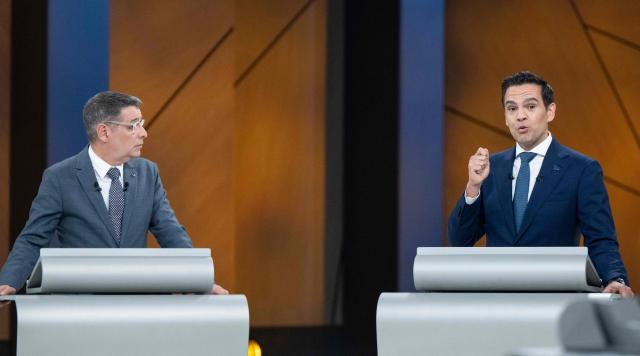 Leader of the Conservative Party of Quebec (PCQ) Eric Duhaime (L) and Leader of the Quebec Liberal Party (PLQ) Charles Milliard (R) participate in the third and final televised Quebec election debate in Montreal, Quebec, Canada on September 23, 2026. Quebec voters will cast their vote on October 5. (Photo by Christopher Katsarov / POOL / AFP)