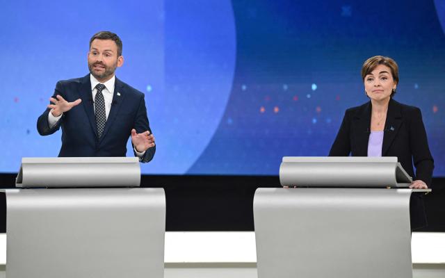 Leader of the Parti Quebecois (PQ) Paul St-Pierre Plamondon (L) and Leader of the Coalition Avenir Quebec (CAQ) Christine Frechette (R) participate in the third and final televised Quebec election debate in Montreal, Quebec, Canada on September 23, 2026. Quebec voters will cast their vote on October 5. (Photo by Graham Hughes / POOL / AFP)