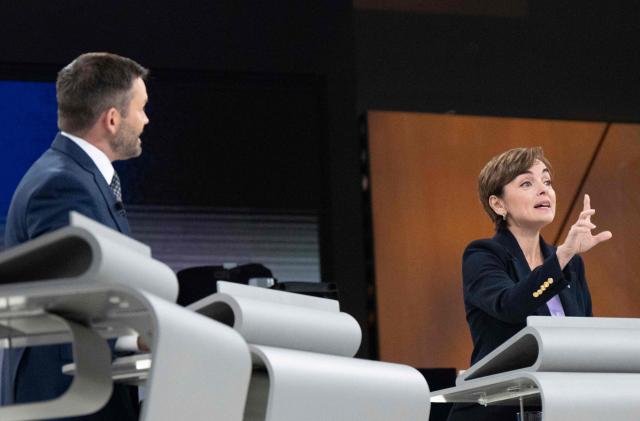 Leader of the Parti Quebecois (PQ) Paul St-Pierre Plamondon (L) and Leader of the Coalition Avenir Quebec (CAQ) Christine Frechette participate in the third and final televised Quebec election debate in Montreal, Quebec, Canada on September 23, 2026. Quebec voters will cast their vote on October 5. (Photo by Christopher Katsarov / POOL / AFP)