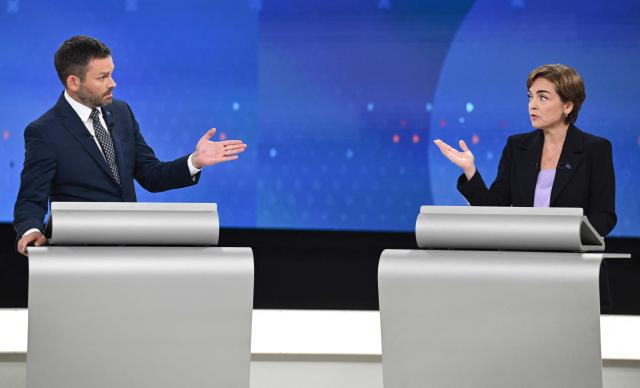 Leader of the Parti Quebecois (PQ) Paul St-Pierre Plamondon (L) and Leader of the Coalition Avenir Quebec (CAQ) Christine Frechette (R) participate in the third and final televised Quebec election debate in Montreal, Quebec, Canada on September 23, 2026. Quebec voters will cast their vote on October 5. (Photo by Graham Hughes / POOL / AFP)