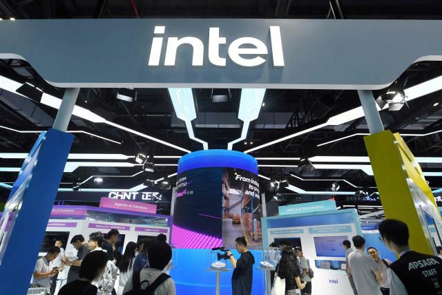 People visit the booth of US chipmaker Intel during the 5th Global Digital Trade Fair in Hangzhou, eastern China's Zhejiang province on September 22, 2026. (Photo by CN-STR / AFP) / China OUT