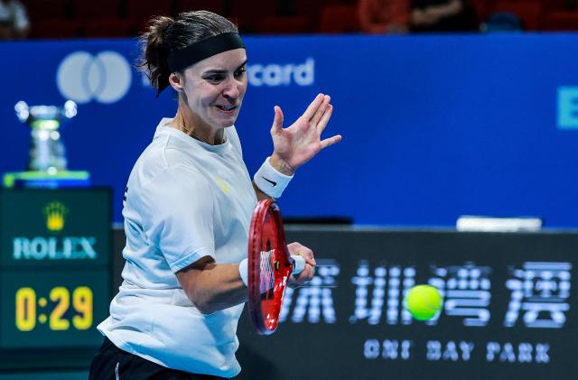 Ukraina's Anhelina Kalinina hits a return to Belgium's Jana Otzipka during their women's singles quarter-final match at the Billie Jean King Cup tennis tournament in Shenzhen, southern China's Guangdong province on September 24, 2026. (Photo by CN-STR / AFP) / China OUT
