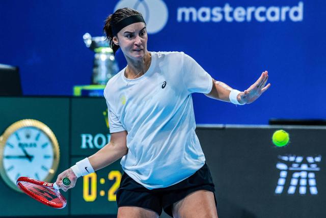 Ukraina's Anhelina Kalinina hits a return to Belgium's Jana Otzipka during their women's singles quarter-final match at the Billie Jean King Cup tennis tournament in Shenzhen, southern China's Guangdong province on September 24, 2026. (Photo by CN-STR / AFP) / China OUT