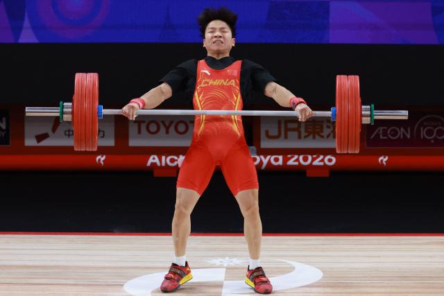 China's Yang Yang competes in the men's 60kg weightlifting final at the 2026 Asian Games in Nagoya on September 24, 2026. (Photo by DAVID GRAY / AFP)