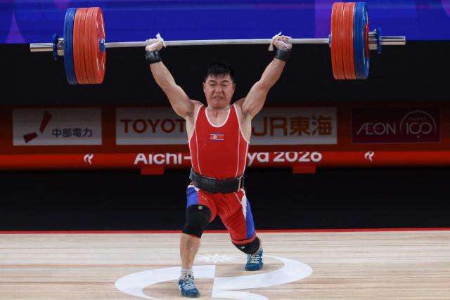North Korea's Pang Un Chol competes in the men's 60kg weightlifting final at the 2026 Asian Games in Nagoya on September 24, 2026. (Photo by DAVID GRAY / AFP)