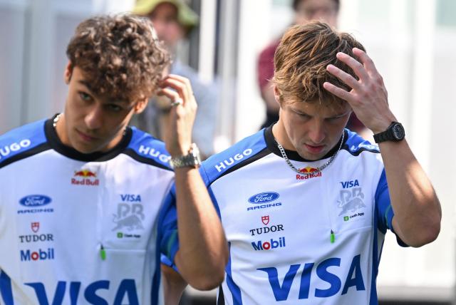 Racing Bulls' British driver Arvid Lindblad and Racing Bulls' New Zealand driver Liam Lawson arrive in the paddock for the first practice session ahead of the Formula One Azerbaijan Grand Prix at the Baku City Circuit in Baku on September 24, 2026. (Photo by Igor IVANKO / AFP)