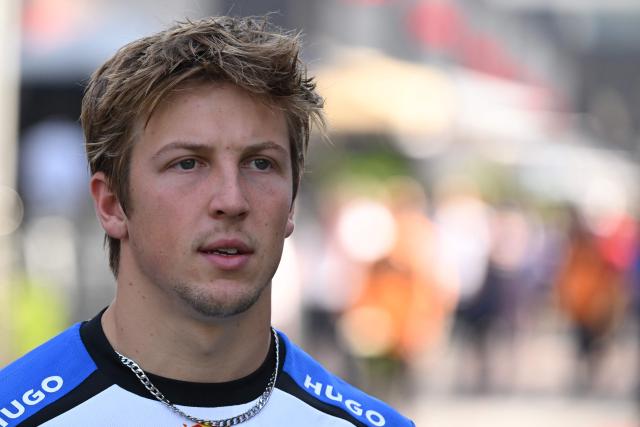 Racing Bulls' New Zealand driver Liam Lawson arrives in the paddock for the first practice session ahead of the Formula One Azerbaijan Grand Prix at the Baku City Circuit in Baku on September 24, 2026. (Photo by Igor IVANKO / AFP)