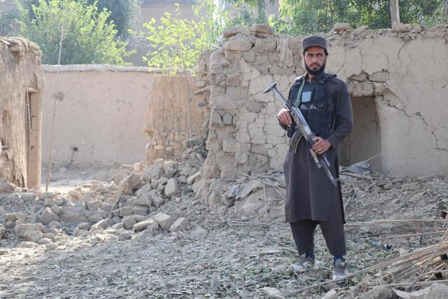 A Taliban security personnel stands guard near a damaged house, after Pakistani airstrike struck Gurbuz district in Afghanistan's Khost province on September 24, 2026. Pakistan's minister of information said its forces had struck 10 targets in Afghanistan -- without specifying where -- accusing its neighbour of allowing "terrorist sanctuaries" on its soil. (Photo by AFP)