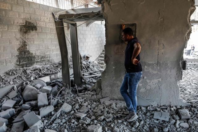A man assesses the damage as he stands amid the rubble of the home of Palestinian prisoner Dawas Hassoun moments after it was demolished by the Israeli army in the Palestinian village of Beit Imrin, in the Israeli-occupied West Bank, on September 24, 2026. Hassoun is accused by Israeli authorities of carrying out a car-ramming attack in March 2026 that killed an Israeli settler. (Photo by Mohammad MANSOUR / AFP)