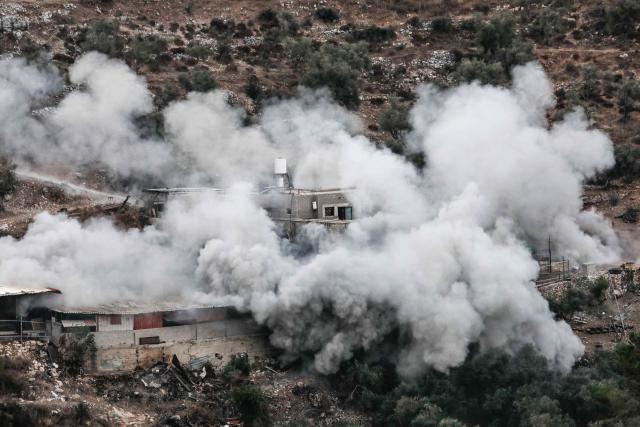 Smoke engulfs the home of Palestinian prisoner Dawas Hassoun during its demolition by the Israeli army in the Palestinian village of Beit Imrin, in the Israeli-occupied West Bank, on September 24, 2026. Hassoun is accused by Israeli authorities of carrying out a car-ramming attack in March 2026 that killed an Israeli settler. (Photo by Mohammad MANSOUR / AFP)