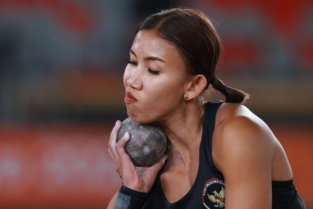 Indonesia's Emilia Nova competes in the women's heptathlon shot put event during the 2026 Asian Games at Nagoya City Mizuho Park Athletic Stadium in Nagoya, Aichi Prefecture on September 24, 2026. (Photo by DAVID GRAY / AFP)