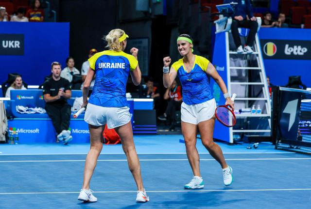 Ukraine's Anhelina Kalinina (R) and Lyudmyla Kichenok (L) react as they play against Belgium's Magali Kempen and Lara Salden during their women's doubles quarter-final match at the Billie Jean King Cup tennis tournament in Shenzhen, southern China's Guangdong province on September 24, 2026. (Photo by CN-STR / AFP) / China OUT