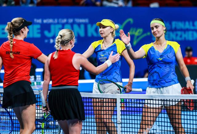 Ukraine's Anhelina Kalinina (R) and Lyudmyla Kichenok (2R) shake hands with Belgium's Magali Kempen (L) and Lara Salden (2L) after their women's doubles quarter-final match at the Billie Jean King Cup tennis tournament in Shenzhen, southern China's Guangdong province on September 24, 2026. (Photo by CN-STR / AFP) / China OUT