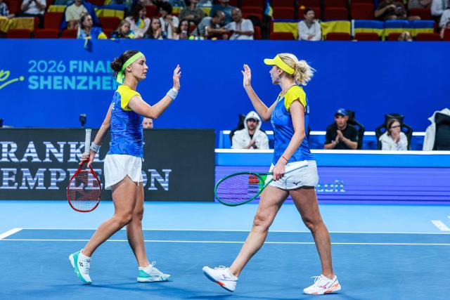 Ukraine's Lyudmyla Kichenok (R)and Anhelina Kalinina (L) react for a point as they play against Belgium's Magali Kempen and Lara Salden during their women's doubles quarter-final match at the Billie Jean King Cup tennis tournament in Shenzhen, southern China's Guangdong province on September 24, 2026. (Photo by CN-STR / AFP) / China OUT