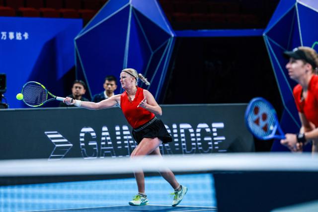 Belgium's Lara Salden (L) hits a return next to Magali Kempen (R) as they play against Ukraine's Anhelina Kalinina and Lyudmyla Kichenok  during their women's doubles quarter-final match at the Billie Jean King Cup tennis tournament in Shenzhen, southern China's Guangdong province on September 24, 2026. (Photo by CN-STR / AFP) / China OUT