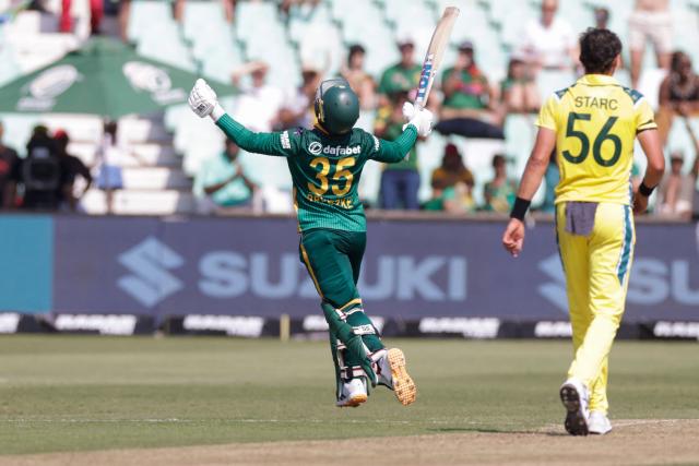 South Africa's Matthew Breetzke raises his bat to celebrates after scoring a century (100 runs)) during the first one-day international (ODI) cricket match between South Arica and Australia at the Kingsmead stadium in Durban on September 24, 2026. (Photo by GIANLUIGI GUERCIA / AFP)
