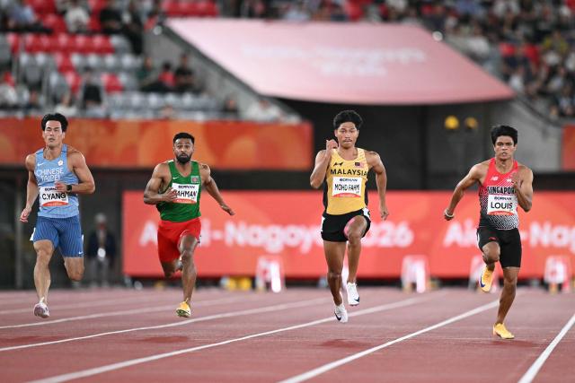 (L-R) Taiwan's Yang Chun-han, Bangladesh's Imranur Rahman, Malaysia's Muhd Azeem Fahmi and Singapore's Marc Brian Louis compete in the men's 100m heat during the 2026 Asian Games at Nagoya City Mizuho Park Athletic Stadium in Nagoya, Aichi Prefecture on September 24, 2026. (Photo by MOHD RASFAN / AFP)