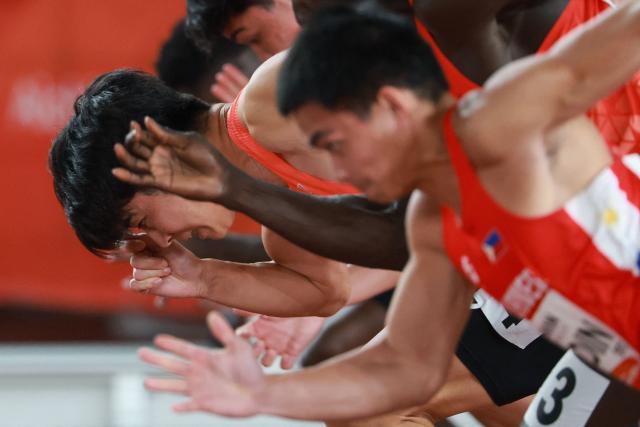 Athletes compete in the men's 100m heat during the 2026 Asian Games at Nagoya City Mizuho Park Athletic Stadium in Nagoya, Aichi Prefecture on September 24, 2026. (Photo by DAVID GRAY / AFP)