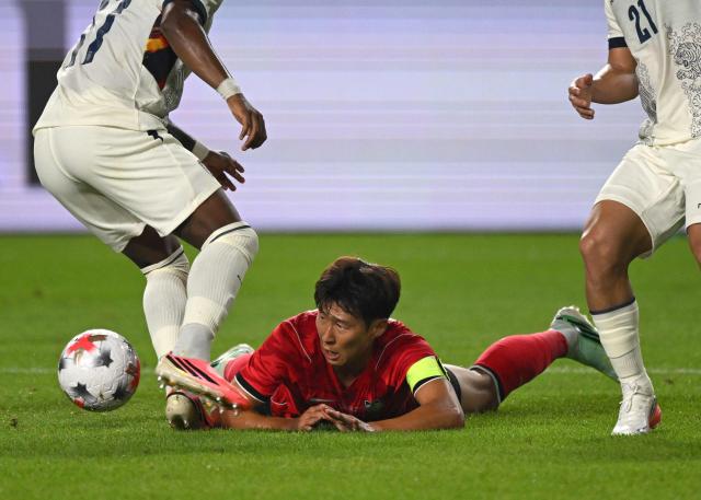 South Korea's Son Heung-min (C) falls down against Ecuador during the friendly football match between South Korea and Ecuador in Suwon on September 24, 2026. (Photo by Jung Yeon-je / AFP)