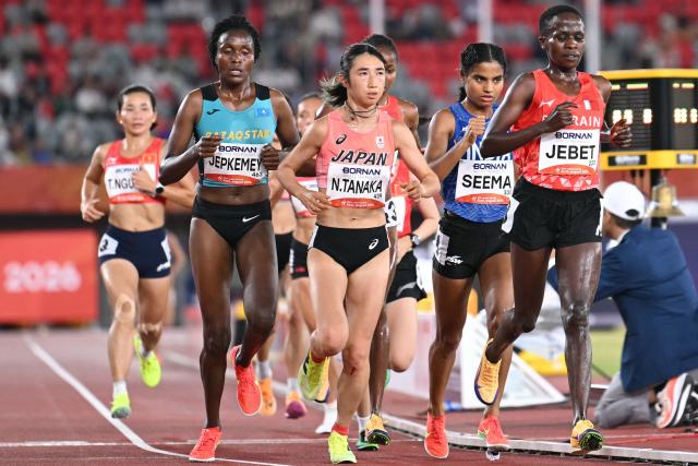 (2L-R) Kazakhstan's Daisy Jepkemei, Japan's Nozomi Tanaka, India's Seema and Bahrain's Ruth Jebet compete in the women's 10000m final during the 2026 Asian Games at Nagoya City Mizuho Park Athletic Stadium in Nagoya, Aichi Prefecture on September 24, 2026. (Photo by MOHD RASFAN / AFP)