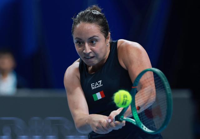 Italy's Elisabetta Cocciaretto hits a return to China's Zhang Shuai during their women's singles quarter-final match at the Billie Jean King Cup tennis tournament in Shenzhen, southern China's Guangdong province on September 24, 2026. (Photo by CN-STR / AFP) / China OUT