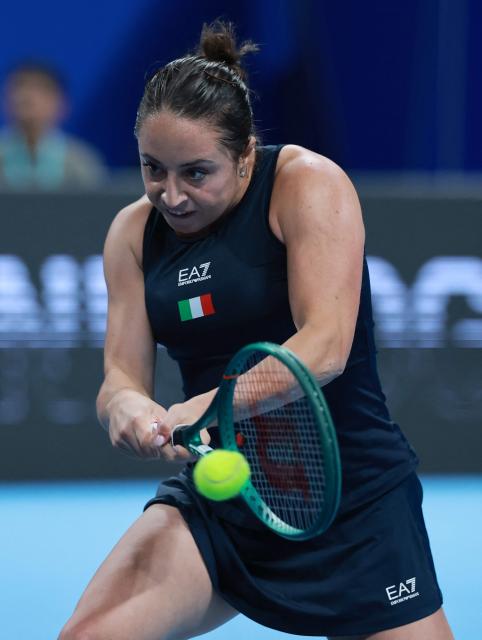 Italy's Elisabetta Cocciaretto hits a return to China's Zhang Shuai during their women's singles quarter-final match at the Billie Jean King Cup tennis tournament in Shenzhen, southern China's Guangdong province on September 24, 2026. (Photo by CN-STR / AFP) / China OUT