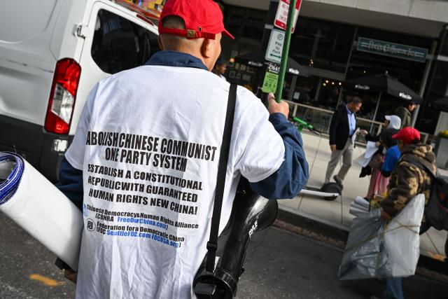 Demonstrators protest against Chinese President Xi Jinping during his state visit in Washington, DC, on September 24, 2026. President Xi is on a State visit to the United States from September 23 to 25. (Photo by Mandel NGAN / AFP)