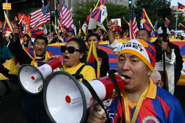 Protesters from the 'Free Tibet' movement outside the Chinese Embassy before Chinese President Xi Jinping arrives at the White House to meet with US President Donald Trump, in Washington, DC, on September 24, 2026. President Xi is on a State visit to the United States from September 23 to 25. (Photo by Alex WROBLEWSKI / AFP)