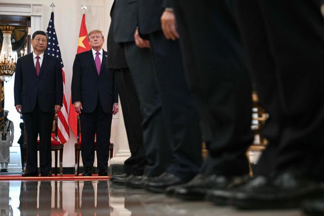 US President Donald Trump and China's President Xi Jinping arrive in the Cross Hall of the White House before delivering remarks, in Washington, DC, on September 24, 2026. President Xi is on a State visit to the United States from September 23 to 25. (Photo by Brendan SMIALOWSKI / AFP)