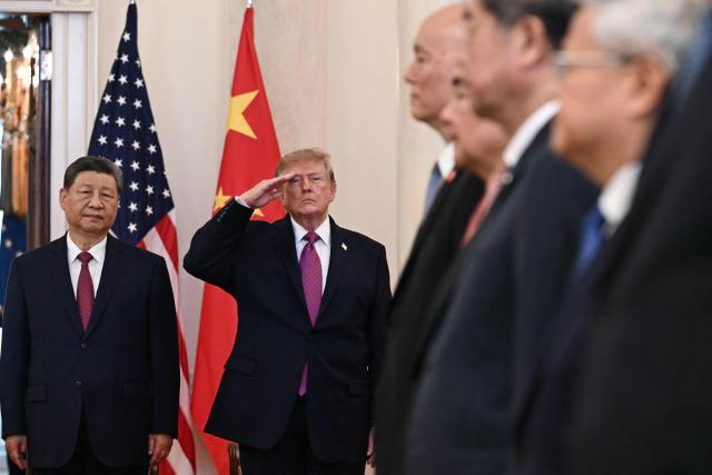 US President Donald Trump and China's President Xi Jinping stand in the Cross Hall of the White House before delivering remarks, in Washington, DC, on September 24, 2026. President Xi is on a State visit to the United States from September 23 to 25. (Photo by Brendan SMIALOWSKI / AFP)