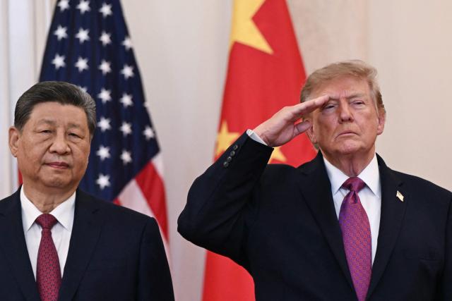 US President Donald Trump and China's President Xi Jinping stand in the Cross Hall of the White House before delivering remarks, in Washington, DC, on September 24, 2026. President Xi is on a State visit to the United States from September 23 to 25. (Photo by Brendan SMIALOWSKI / AFP)