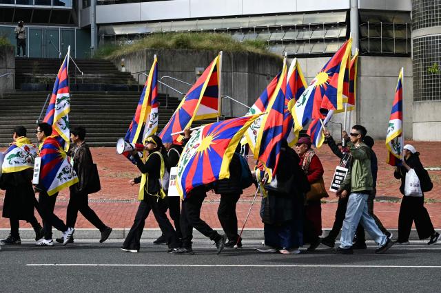 Protesters from the 'Free Tibet' movement outside the Chinese Embassy before Chinese President Xi Jinping arrives at the White House to meet with US President Donald Trump, in Washington, DC, on September 24, 2026. President Xi is on a State visit to the United States from September 23 to 25. (Photo by Alex WROBLEWSKI / AFP)