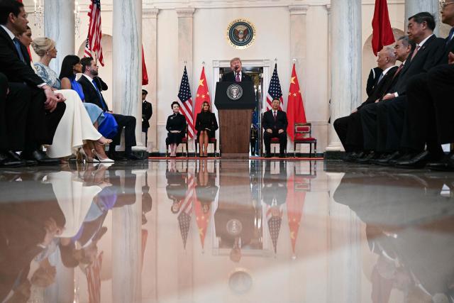 US President Donald Trump speaks alongside US First Lady Melania Trump, China's First Lady Peng Liyuan, and China's President Xi Jinping, in the Cross Hall of the White House in Washington, DC, on September 24, 2026. President Xi is on a State visit to the United States from September 23 to 25. (Photo by Brendan SMIALOWSKI / AFP)
