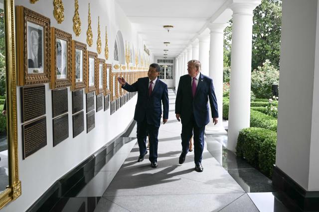 China's President Xi Jinping and US President Donald Trump walk along the Colonnade on their way to participate in a military review in the Rose Garden of the White House in Washington, DC, on September 24, 2026. President Xi is on a State visit to the United States from September 23 to 25. (Photo by Brendan SMIALOWSKI / AFP)