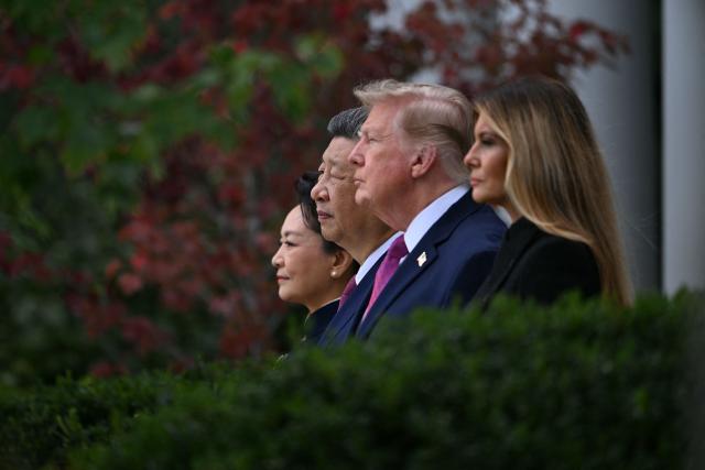 (L/R) China's First Lady Peng Liyuan, China's President Xi Jinping, US President Donald Trump and US First Lady Melania Trump look on during a military review in the Rose Garden of the White House in Washington, DC, on September 24, 2026. President Xi is on a State visit to the United States from September 23 to 25. (Photo by Brendan SMIALOWSKI / AFP)