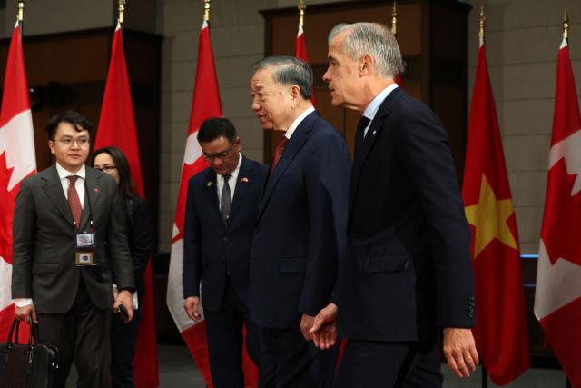 Canada's Prime Minister Mark Carney (R) with Vietnamese President To Lam during a welcoming ceremony at the Parliament of Canada September 24, 2026 in Ottawa, Canada. (Photo by Dave Chan / AFP)