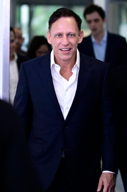 German-US entrepreneur, venture capitalist and conservative political activist Peter Thiel Peter Thiel arrives on the red carpet for the Axel Springer Award in Berlin on September 24, 2026. (Photo by Tobias SCHWARZ / AFP)
