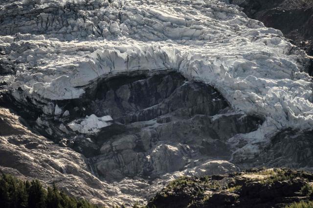 This photograph shows a view of a hole on the Bossons glacier in the Mont-Blanc massif of the Alps in the Chamonix valley, central-eastern France on September 23, 2026. (Photo by JEFF PACHOUD / AFP)