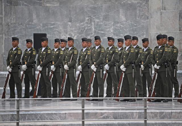 Mexican soldiers observe a minute of silence at the Monument to the Boy Heroes during a ceremony attended by South Korea's President Lee Jae Myung (not in frame) in Mexico City on September 24, 2026. The Monument to the Boy Heroes commemorates six mostly teenage military cadets who were killed in battle defending Mexico City from the United States during the Battle of Chapultepec on September 13, 1847. (Photo by Carl de Souza / AFP)