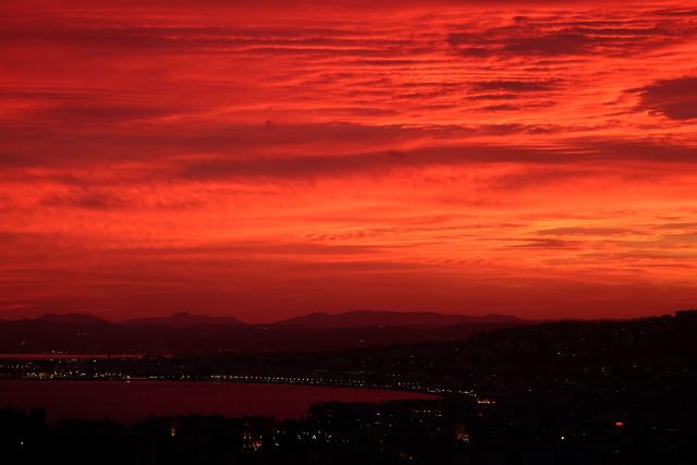 This photograph shows the sunset over the "Baie des Anges" on the French riviera city of Nice, south-eastern France on September 24, 2026. (Photo by Valery HACHE / AFP)