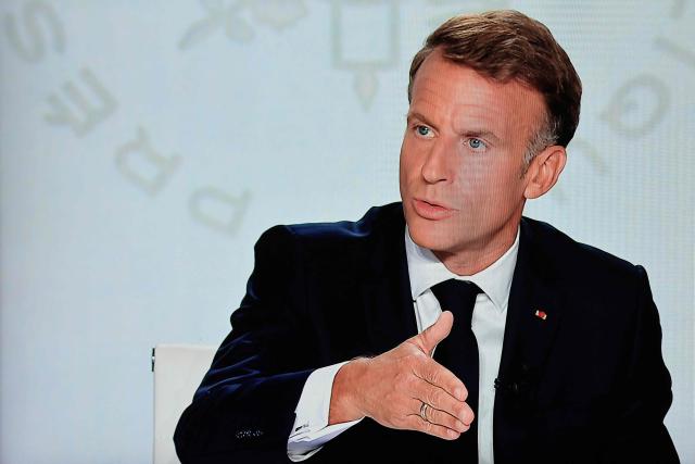 A photo shows a monitor screen as France's President Emmanuel Macron speaks during an interview with France 2 and TF1 at the Elysee Presidential Palace, in Paris on September 24, 2026. The interview is broadcasted live on both French TV channels TF1 and France 2. (Photo by Ludovic MARIN / AFP)