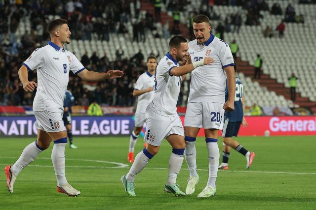 Serbia's midfielder #14 Andrija Zivkovic (C) celebrates with Serbia's midfielder #20 Sergej Milinkovic-Savic (R) and Serbia's forward #08 Luka Jovic after scoring his team's first goal during the UEFA Nations League phase group A2 football match between Serbia and Greece at the Rajko Mitic Stadium in Belgrade on September 24, 2026. (Photo by Pedja Milosavljevic / AFP)