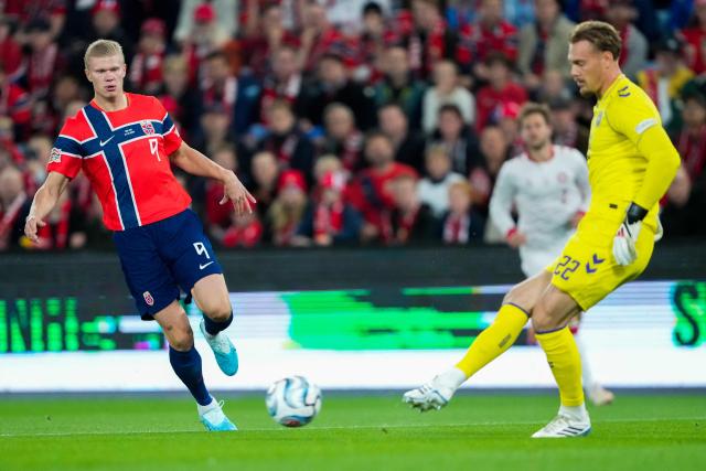 Norway's forward #09 Erling Braut Haaland (L) plays the ball during the UEFA Nations League Group A4 football match between Norway and Denmark in Oslo on September 24, 2026. (Photo by Fredrik Varfjell / NTB / AFP) / Norway OUT