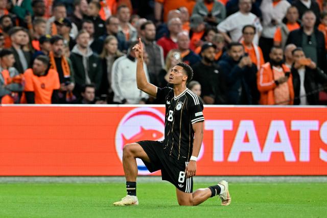 Germany's midfielder #08 Felix Nmecha celebrates after scoring his team's first goal during the UEFA Nations League (League A, Group A2) football match between Netherlands and Germany at Johan Cruijff ArenA in Amsterdam on September 24, 2026. (Photo by NICOLAS TUCAT / AFP)