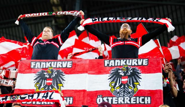 Austria fans display fan scarves and flags to cheer for their team during the UEFA Nations League Group B3 football match between Austria and Israel in Linz, Austria on September 24, 2026. (Photo by GEORG HOCHMUTH / APA / AFP) / Austria OUT