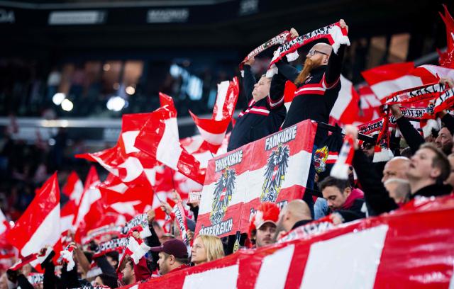 Austria fans display fan scarves and flags to cheer for their team during the UEFA Nations League Group B3 football match between Austria and Israel in Linz, Austria on September 24, 2026. (Photo by GEORG HOCHMUTH / APA / AFP) / Austria OUT