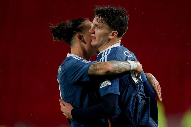 Greece's forward #10 Christos Tzolis (R) celebrates scoring his team's first goal during the UEFA Nations League phase group A2 football match between Serbia and Greece at the Rajko Mitic Stadium in Belgrade on September 24, 2026. (Photo by Pedja Milosavljevic / AFP)