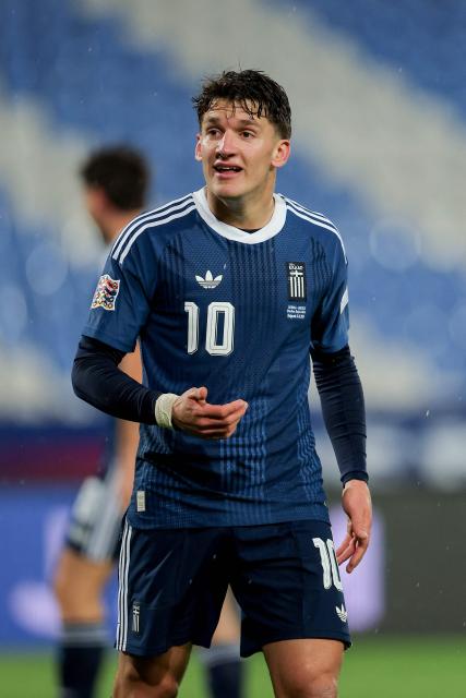 Greece's forward #10 Christos Tzolis celebrates scoring his team's first goal during the UEFA Nations League phase group A2 football match between Serbia and Greece at the Rajko Mitic Stadium in Belgrade on September 24, 2026. (Photo by Pedja Milosavljevic / AFP)