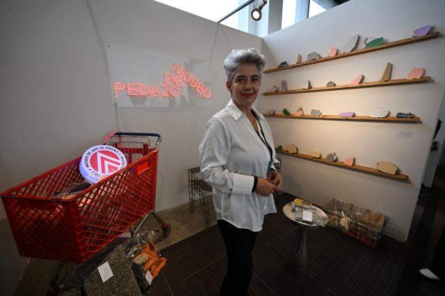 Museum curator Rosa Angel Arenas poses at the installation "Pedazo de museo", composed of fragments from the Pereira Art Museum building damaged in a recent earthquake, during the ARTBO International Art Fair in Bogota on September 24, 2026. (Photo by Raul ARBOLEDA / AFP)