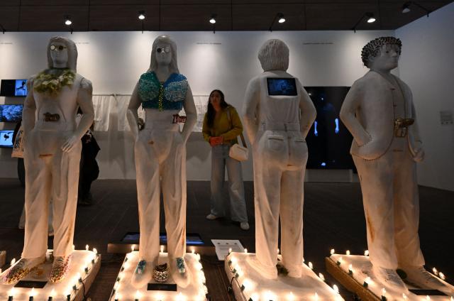 A visitor looks at "Trans-migraciones", an artwork by the collective Mapa Teatro, during the ARTBO International Art Fair in Bogota on September 24, 2026. (Photo by Raul ARBOLEDA / AFP)